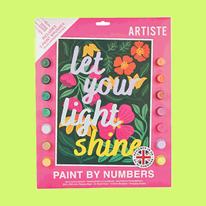 Shop display of colourful arts and crafts supplies, including paint-by-numbers kits, crochet kits, markers, and poster paints