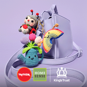 Multi coloured bag charms are stacked against a lilac handbag with a lilac background. The TK Maxx, Homesense and The King’s Trust logos appear beneath.