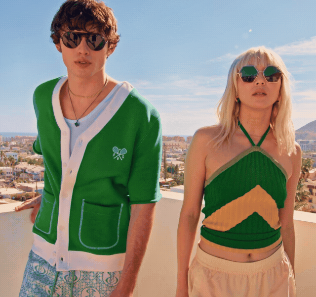 A GIF of a male and female model wearing summer 'fits walking in the sunshine.
