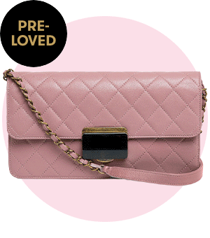 A GIF of designer handbags against a pink backdrop.