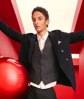 A man wearing a smartly tailored three-piece suit