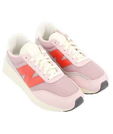 A pair of pink, peach and white trainers for women.