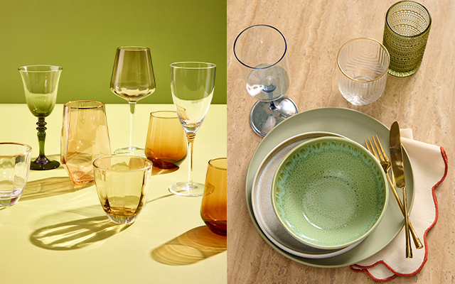 Glassware arranged on a table beside a place setting with plates, bowl, cutlery and glasses.