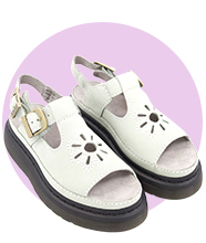 A pair of white chunky leather sandals.