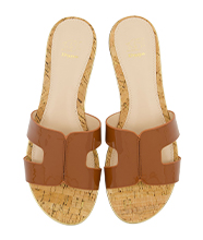 Pair of brown slide sandals.