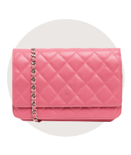 A pink quilted leather bag with contrasting chain strap.