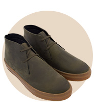 A pair of olive green lace-up shoes 