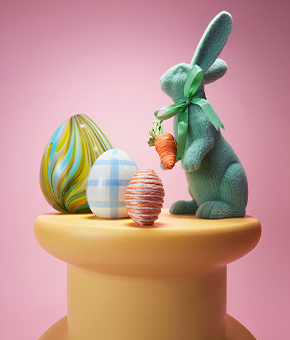 Easter eggs and a bunny on top of a table.