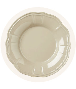 A cream plate with a wobbly edge.
