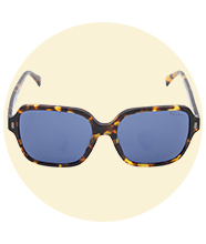 Oversized tortoiseshell square-frame sunglasses with blue tinted lenses, shown front-on against a soft circular background.				