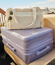 A stack of designer suitcases