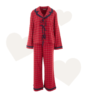 A GIF showing red checked pyjamas, heart-shaped chocolates, gold earrings and some flowers in a glass vase.