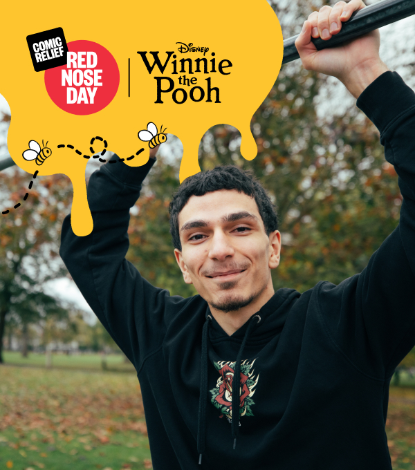 An image of Mehmet smiling in a park.