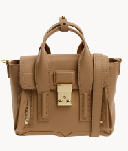 A small tan structured leather handbag with top handles and a gold front clasp, shown against a plain white background.