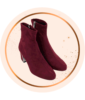 A pair of burgundy suede ankle boots