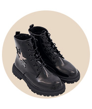 A pair of leather boots with star detailing. 