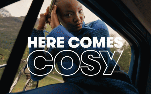 A GIF showing a male and female model wearing bright, cosy knits in a countryside setting.