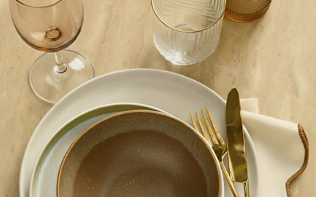Two images alongside each other: one shows a neutral tablescape with a vase, candle and ornaments; the other shows three woven baskets.