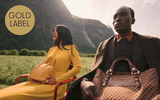 GIF of man and woman sitting outdoors in monochrome outfits and children playing wearing knitted jumpers and hats.