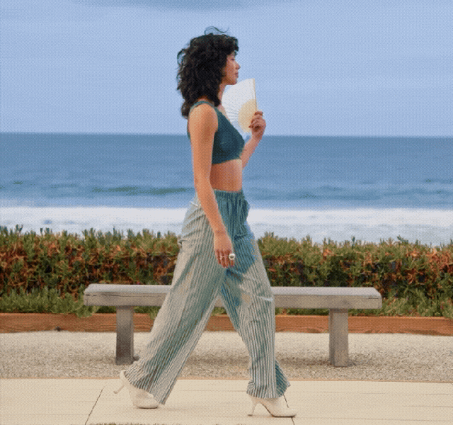 A GIF of a model wearing different summer outfits: a floral-print maxi, a bright red midi and blue co-ord. 