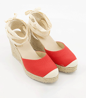 GIF of designer espadrailles wedge sandals, jewelled flat sandals and more.