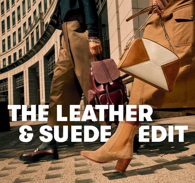 People walk through a city street carrying leather and suede bags, wearing neutral-toned footwear and clothing. Text says “THE LEATHER & SUEDE EDIT”.