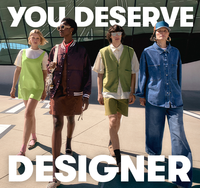 Four models walking wearing transitional clothing 