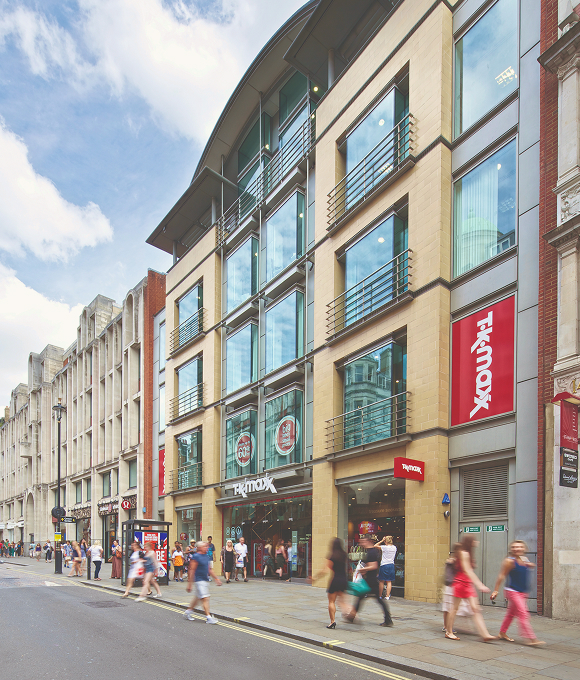 The exterior of a TK Maxx store on a street. 