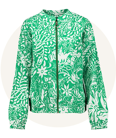 Green zip-up jacket with white floral pattern, long sleeves and round neckline, shown front-facing against a light neutral background.