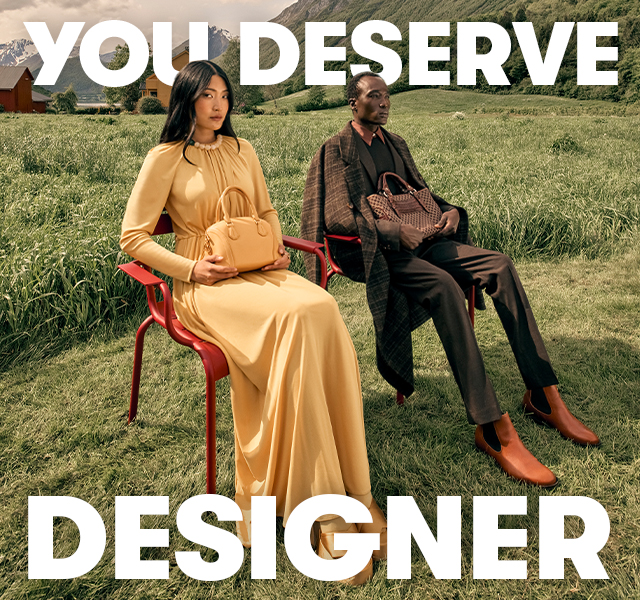 Two models sitting on chairs wearing head-to-toe tonal outfits 