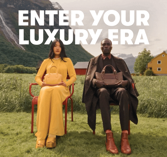 A gif of a woman in yellow and a man in brown seated and crossing their legs.