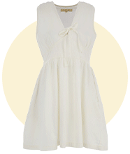 White sleeveless mini dress with a V‑neckline and tie detail at the front.