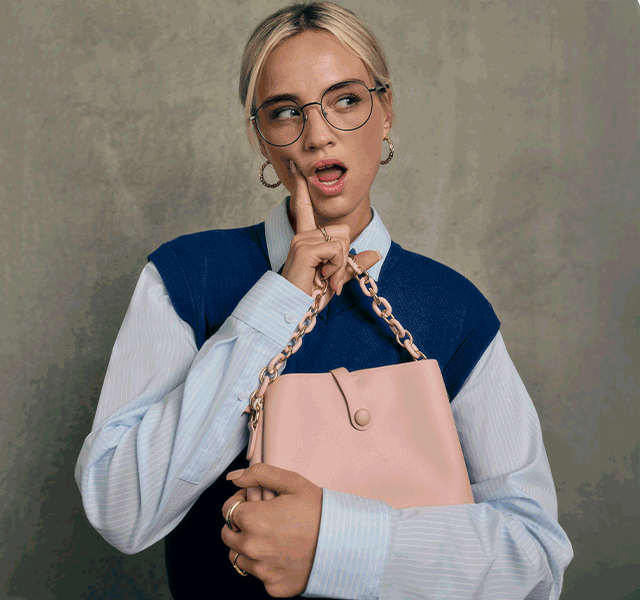 Young workers in a lift wearing stylish clothes from TK Maxx.
