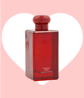 A luxury aftershave in a red bottle with a rounded top. 